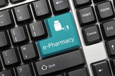 Close-up view on conceptual keyboard - e-Pharmacy (blue key)